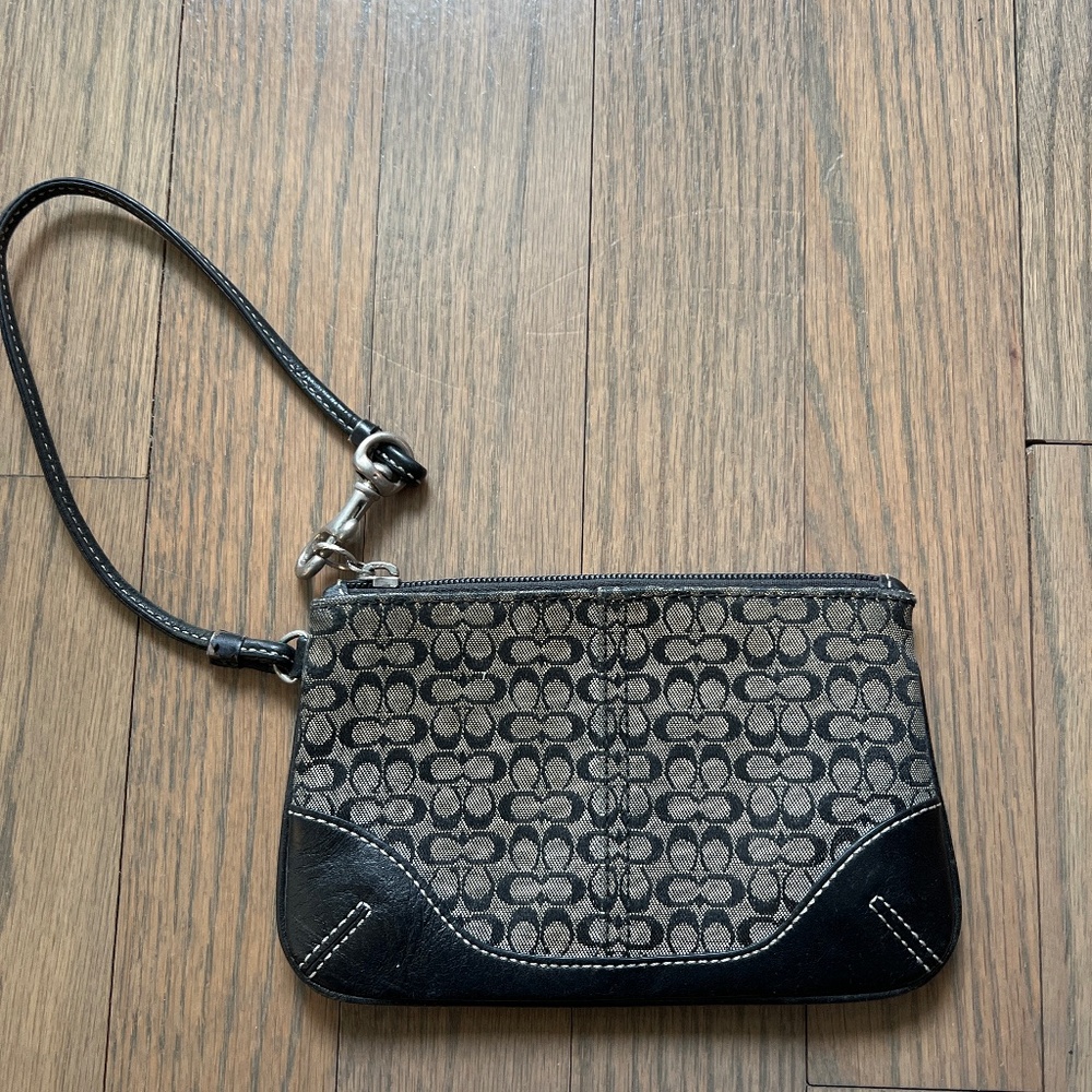 Black and gray Coach wristlet